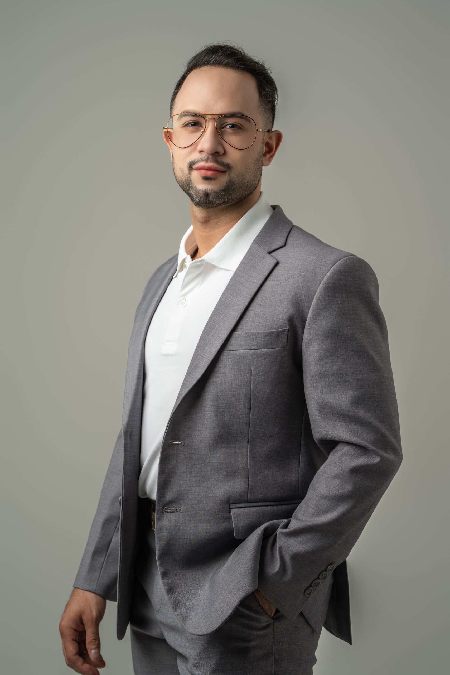 corporate portrait man standing with suit and confident look